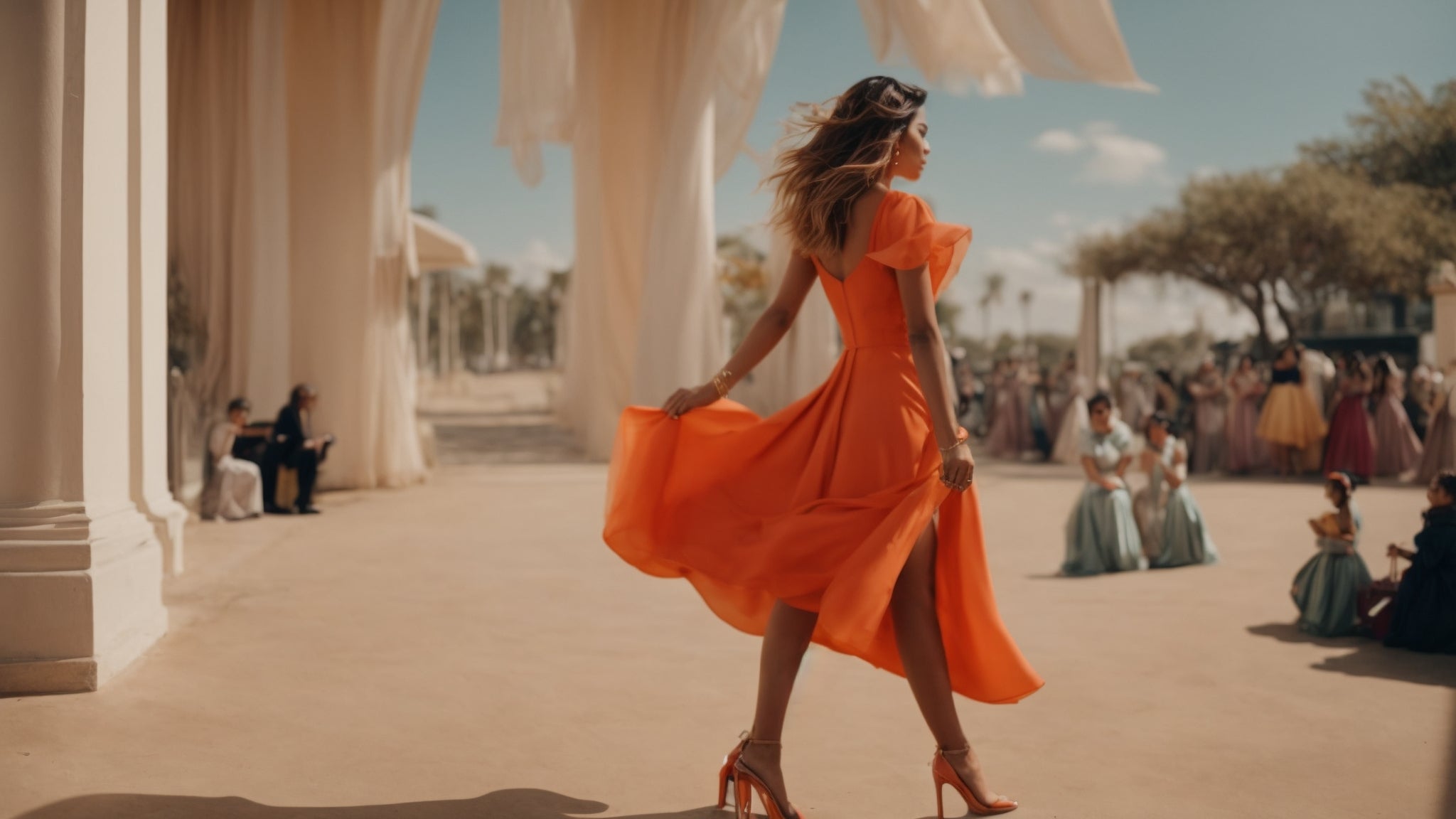 Women in orange dress with wind blowing the skirt on the dress